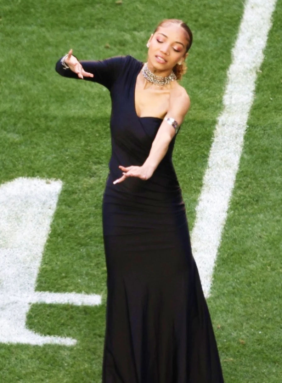 Justina Miles signing during the Super Bowl halftime show